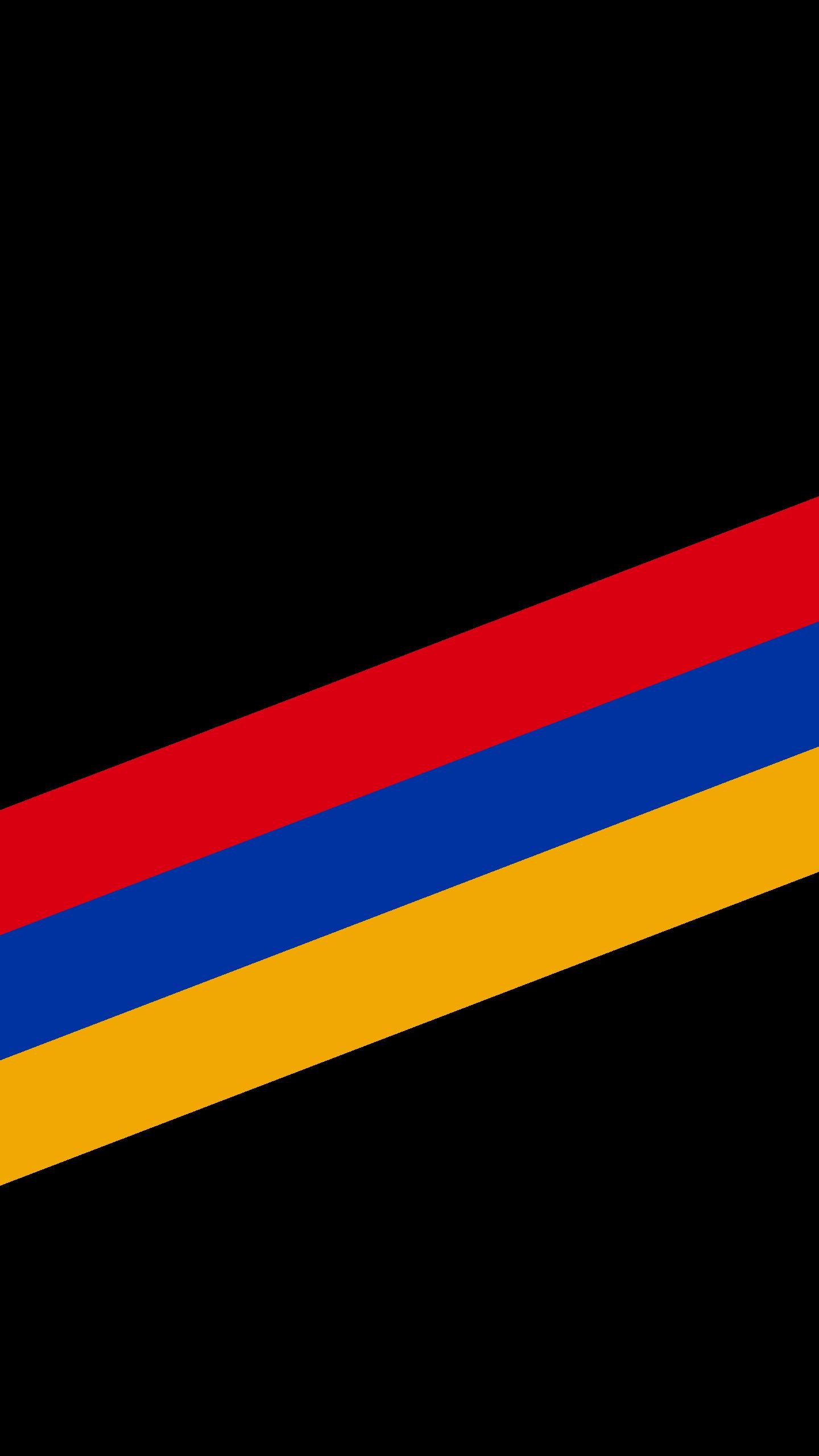 A black wallpaper with red, blue and gold stripes.