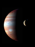 The planet Jupiter, but with only the left-hand side of the planet visible; the other half is hidden in shadow. A smaller moon is passing in front of it, also partially in shadow.