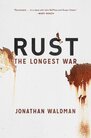 The cover of “Rust”. It’s a white background with the title in black text, and flecks of reddish-orange rust across the cover.