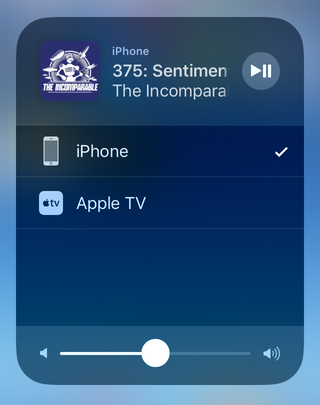 A media player with a list of output sources: iPhone and Apple TV.