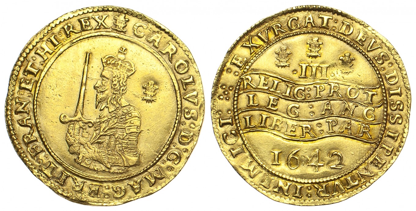 The front and back of two gold coins. The left coin (front) shows a man holding a sword, the right (back) has some text in Latin.