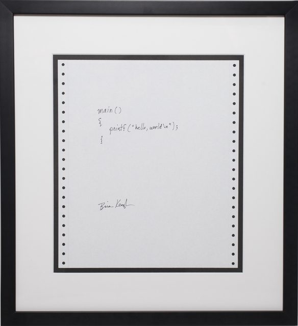 A hand-written and signed C program, mounted in a black frame.