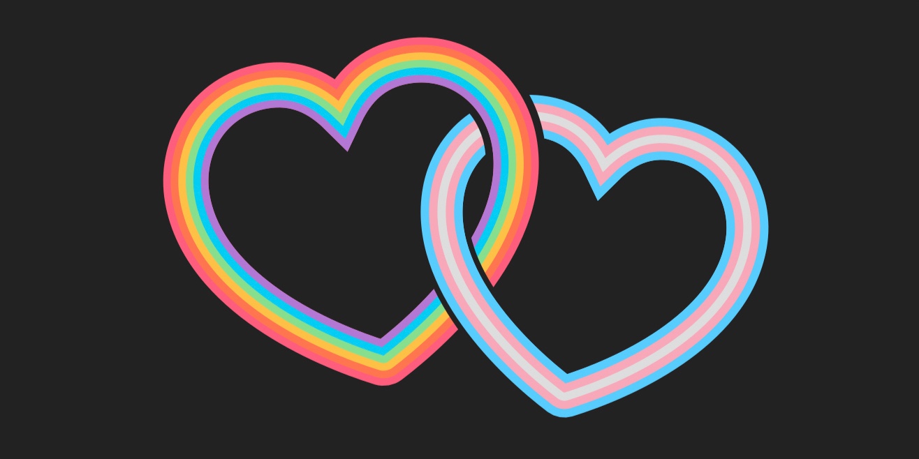 Two interlocking hearts on a dark background. The left heart is the colours of the rainbow pride flag (red, orange, yellow, green, blue, purple), and the right heart is the colours of the trans pride flag (baby blue, baby pink, white, baby pink, baby blue).