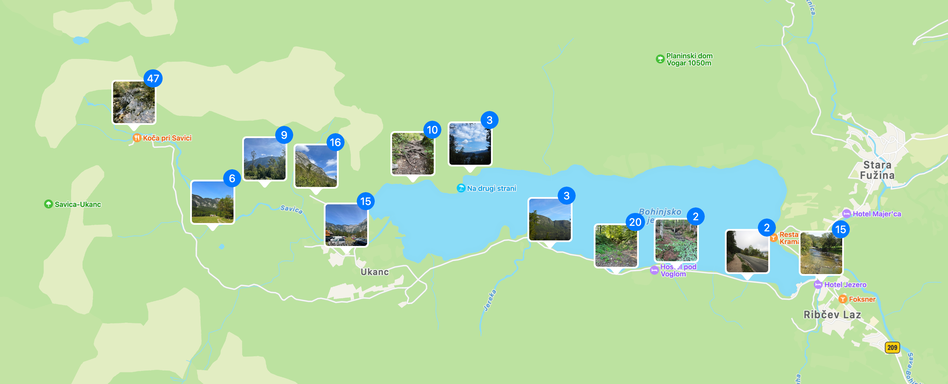 A map view of Lake Bohinj. Dotted around the map are small markers with a photo and number, showing the number of photos taken at that exact location.