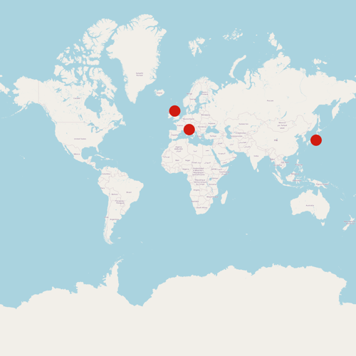 A map of the world with three large red dots in Scotland, Italy, and Japan.