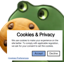 A green cartoon frog holding up a cookie with a GDPR consent form on top of it