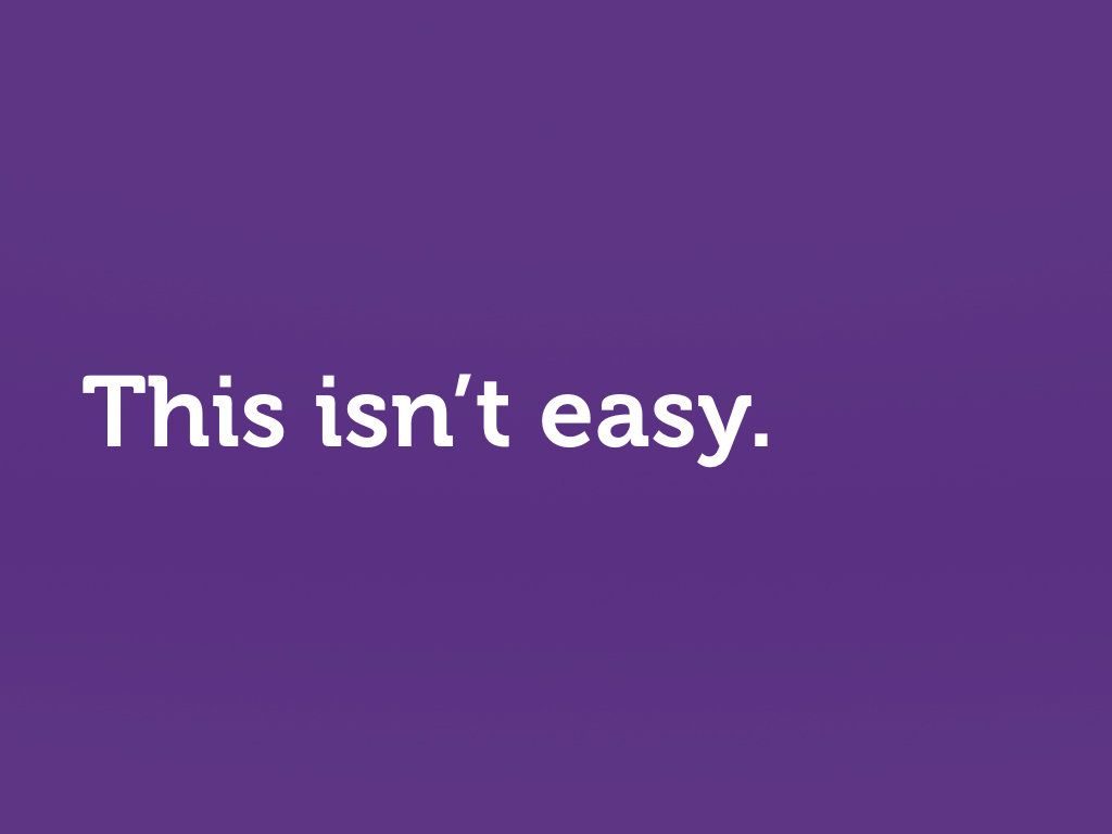 White text on purple. “This isn’t easy.”