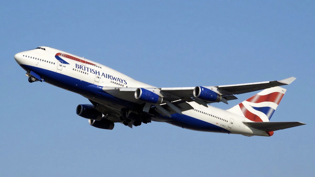 A British Airways plane set against a blue sky.